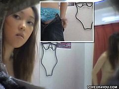 This Asian girl picked up a white sexy lingerie set and went in the fitting room to try it on. A spy cam caught her undressing and dressing and revealing her intimate parts.