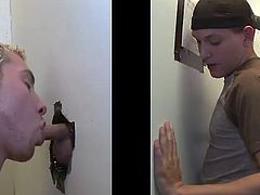A kinky blond poofter is having a good time indoors. He finds a cock sticking out of a gloryhole and sucks it as best as he can.-