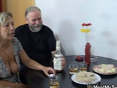 This guy drinks too much and falls asleep at the table. His girlfriend fools around with his mom and she ends up getting fucked by his dad after blowing his cock.