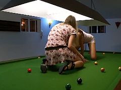 Ivana and Mia kiss each other on a pool table, strip and go wild. After licking and fingering their pussies, they mimic normal sex from the doggy style position.