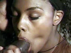 Curly-haired ebony chick Vanity is having fun with a black guy. She favors him with a blowjob, then leans against a sofa, welcoming his BBC in her pussy.