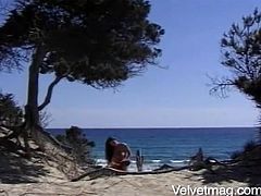 A lustful brunette whore sunbathes on a beach. She also has sex there. A guy licks her pussy and fucks between boobs. Of course she also gets her ass fucked.