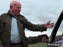 This brunette's car broke down and his grandpa fixed it for her. She wanted to pay him, but he wanted her. She agreed, stripped and had her pussy licked by him.