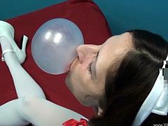 The gorgeous cougar nurse Marie Madison will get you really horny as she makes bubbles with her gum while she wears her sexy uniform and high heels.