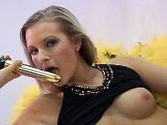 Sandy is a sensual blonde. She does kinky stuff, but she looks classy when she does it. Sucking on that golden vibrator looks like fun for her and toying her pussy too.