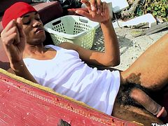 Get wild by watching this ebony dude, with a nice butt wearing a cap, while he goes hardcore with a gay fellow outdoors and moans loudly.
