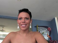 A vivacious young shemale with short dark hair, small natural tits and a fabulous body enjoys masturbating in her living room.