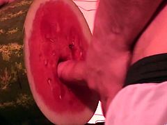 This horny dude with a nasty food fetish shoots a huge load of hot cum after screwing a watermelon as if it were a delicious pussy.