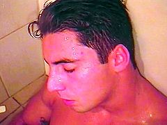 Tattoo latino dude takes a shower as his dick grews stiff