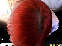 Redhead Phoenix Askani opens her mouth invitingly in cock sucking action with Voodoo