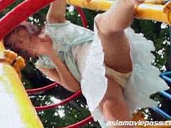 This Asian girl poses in a child park and then she masturbates with a vibrator. More than six guys bang her and cum on her face. She eats the cum at the end.