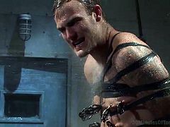 Will this gay slave be able to handle 30 straight minutes of water torture. The dungeon master has tied up this gay slave with straps, and the slave cannot move. The dominator turns the hose on the slave and gets him soaked.