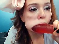 Hot redhead sucks dildo on webcam