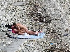 Couple fucked on a public beach while as people walked near