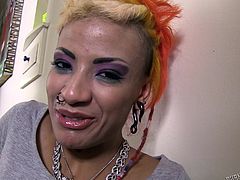 If you are into uninhibited punk chicks, capable to offer exciting thrills to horny partners, click to meet Roggie, a sexy girl with short dyed hair and beautiful tits. The bitch looks pretty with all those piercings and tattoos, which are a huge turn on. See her fingering her lusty cunt and sucking cock.