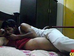 Indian couple is in their room all alone and started passionate kissing. The guy removes her panties and started to lick her cunt and finger fucking making her girl moan so much.