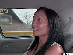 Raven haired busty Colombian mom Casandra is proud of her perfect huge fake boobs. Thats why she takes off her tight top and bra in the back of a car in front of the camera with no shame!