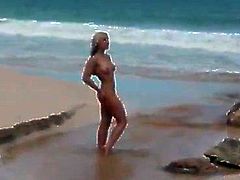 Hot ass Ashley Fires gets naked at the beach and plays in the water