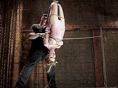 Do you find bonded girls attractive? If so, don't miss the crazy scenario, where a blonde-haired slut is strongly tied up with ropes. Ashley is hanging upside down and the creative bondage allows her to experiment brutal orgasms. The kinky sexy game supposes the use of a vibrator. Whipping also helps. Watch!