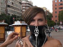 Sandra is a a mistress, who loves to humiliate her subject publicly. That's why she tied up her bitch Camil and walks her around naked. She tied her hands and mouth with latex collar and chains, and walks her around, to find a good place to get her fucked the way she deserve.