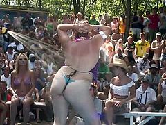 A few kinky women demonstrate their butts in front of a crowd