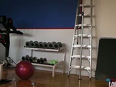 Sporty brunette girl brags of her ass while doing exercises in the gym