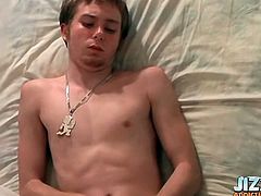 Masturbating young guy cums on his chest