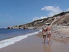 2 GIRLS WITH GREAT BOOBS ARE WALKING IN THE BEACH