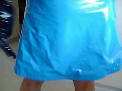 Asian in blue PVC skirt and top