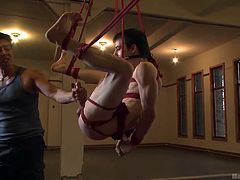 Worthless Brian is nothing but an insignificant slave to satisfy sadistic pleasures. He is frog tied and hanged from the ceiling and the guys, who fastened the knots, are toying with him. Watch them feet teasing him and jerk his cock, while they put a big toy in his tight ass and make him whimper like a bitch!