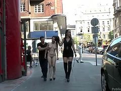 It has been decided, that slutty Chiara deserved to be disgraced in public. There's no better way to humiliate this brunette bitch, than walking her completely naked and mouth gagged through the streets... Once they arrive in a clothes' shop, her angry guardians persuade the naughty babe into sucking cock. See!