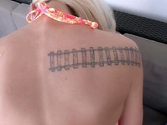 Amazingly cute blond-haired skinny girl Halle Von strips down to her bikini. She shows her tattoos and gets her butt cheeks rubbed in front of the camera with her bikini on.