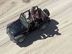 Busty Mercedes Carrera gets in a jeep and takes off her top. She then gets driven around the beach with the hot sun tanning her tight body. She then humps the driver.