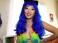 Lovely asian chick Miko Dai with long blue hair and rainbow bra drops on her knees and gives blow job with her big beautiful eyes wide open. Watch her blow from your point of view.