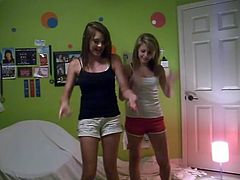 Two pretty teens dancing in shorts