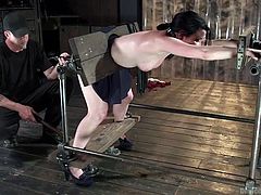 Veruca's punishment involves being put in devices similar to the old torture, devices known as stocks. She is restrained well and her mouth is covered, so her screams of pain and pleasure are completely muffled. Her executor uses a vibrator on her among other things, making her pussy wet and body squirm.