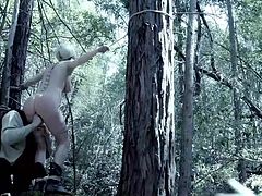 A perverse guy has found slutty Cherry and tied her in a strong creative rope bondage, in the woods. The naked babe with nice big boobs has also been gagged, so no one could hear her terrifying screams. Watch her cunt fingered with anger and lust!