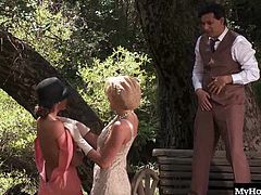 They get it on in a hot outdoor threesome on a park bench in period costumes from the 1920s. They are into pleasuring Clide, played by Paul Chaplin, by sitting on his face and also sitting on his cock to make him cum on their faces.