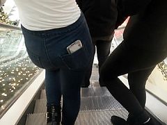 2 asses on the escalator