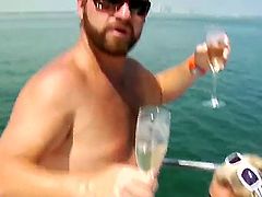 Mature blonde is on a boat. She is giving the skipper a blow job. Her mouth work is good and then man soon cums into her face. She has some body oil on her.