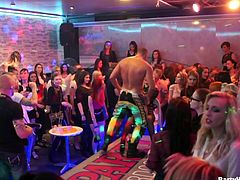 All the women want a piece of this hot male stripper. There is a huge crowd at the club to see the hunk give this busty blonde bitch an amazing lap dance. Will they get to fuck this male dancer? Watch and find out.