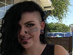 Luna is pretty, has a great body and some pretty wild tattoos, and piercings. She sits outside with this guy and talks, before showing off her pretty ass and her nice set of tits. She shows off her mouth and tongue next, as she gets on her knees, and sucks on his swollen manhood.