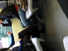 Girl in black tights and flats on train