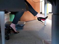 dangling her louboutin under desk 6