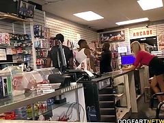 Busty blonde Lexi Lowe gets gangbanged and assfucked in adult video store by many black guys.