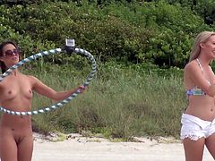 The group of sexy and fuckable babes are having a very good time down at the beach. Enjoy the sun and have some fun with the hula hoop. Even better - do it naked! They are rewarded with cash for the public nudity.