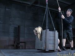 There is nothing more humiliating than being in a dungeon - except being in a dungeon and being put in a tiny box. Her ass his hanging out, so the master can have his way with her. He sprays her down and emasculates her.