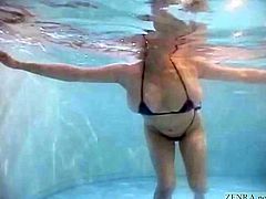 Unfaithful Japanese wife with huge breasts popping out of a tiny bikini takes a dip in a love hotel swimming pool before going skinny dipping followed by a titjob and blowjob with English subtitles