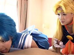 Fanboys of cosplay girls are in heaven, when they get to act out their fantasies. This guy has two beautifully delicate women playing with his body and using their pretty, perfect mouths on his dick, licking and sucking it.