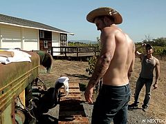 The topless hunks were out in the back 40 working on their atv. Wouldn't you like to be helping out these hunky, sweaty muscled men? The hard work makes them horny, so one of the gay cowboys drops to his knees to suck cock.